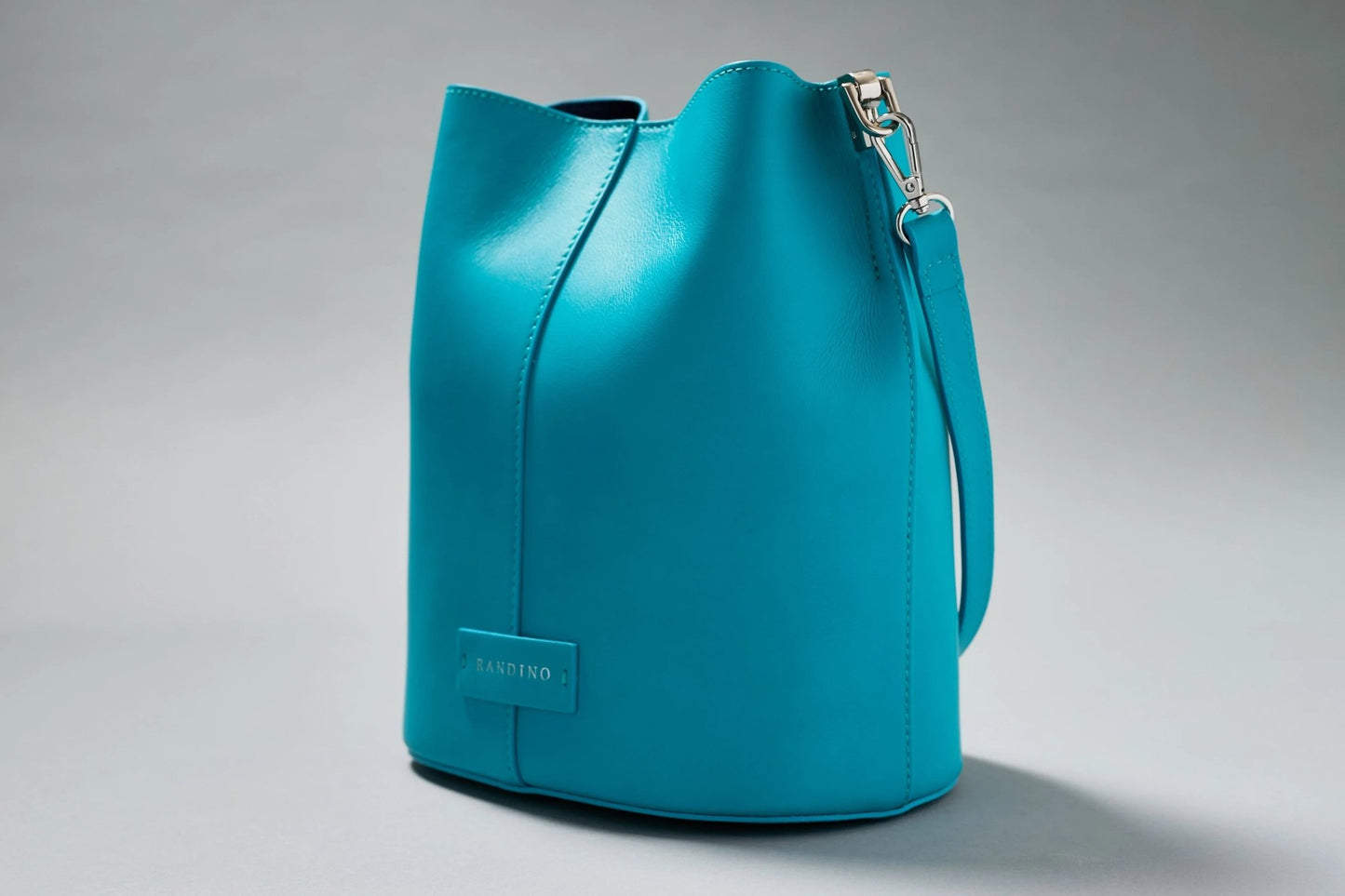 Black streetwear bucket bag by Randino – minimalist design
